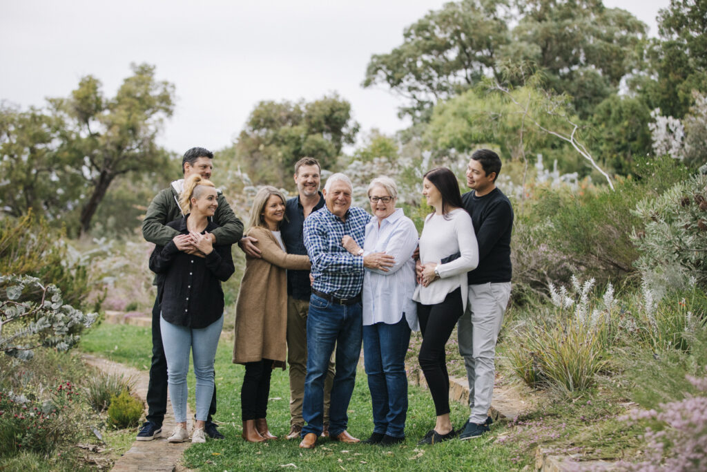 Extended family photography session at Kings Park in Perth with grandparents and adult children enjoying time together